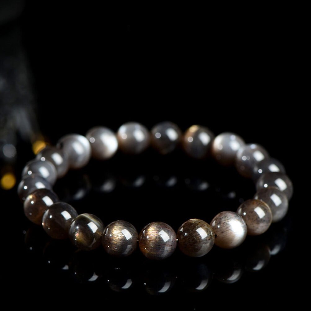 High-shine black skeleton crystal bracelet with clear hematite fibers and cat's eye effect