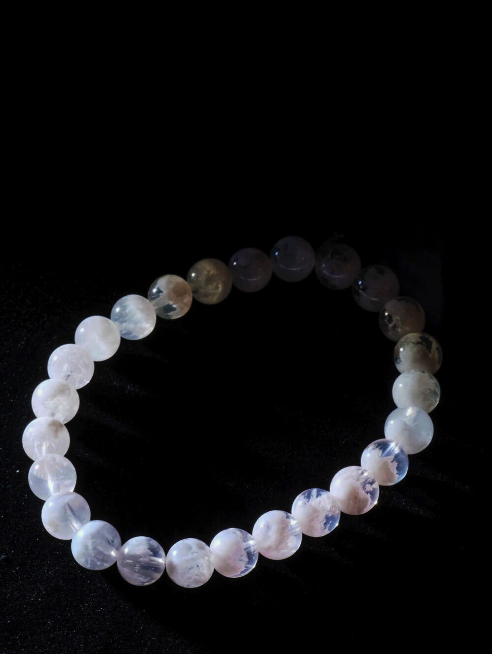 Natural White Phantom Crystal Bracelet featuring snowflake-like textures in each bead.