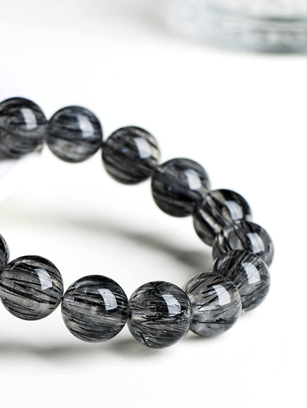 Natural Black Tourmaline Rutilated Quartz Bracelet, with dark inclusions creating a captivating, mysterious effect.